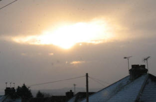 Pitmans Shorthand Christmas Carols: Dawn sun and snow shower over Orpington, Kent