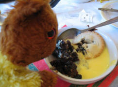 Pitmans Shorthand Christmas Carols: Yellow Teddy eating Christmas pudding